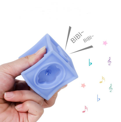 Child holding PERA FASHION Soft Building Blocks Relief Blocks that make sounds, encouraging imaginative play.